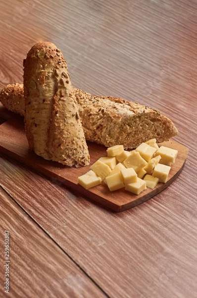 Obraz bread and cheese on wooden table