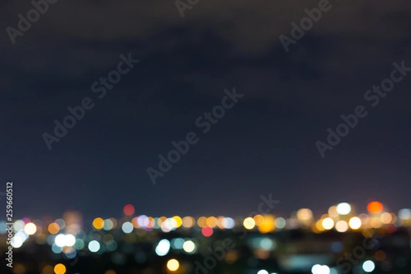 Fototapeta city night with dark sky, abstract blur bokeh light background