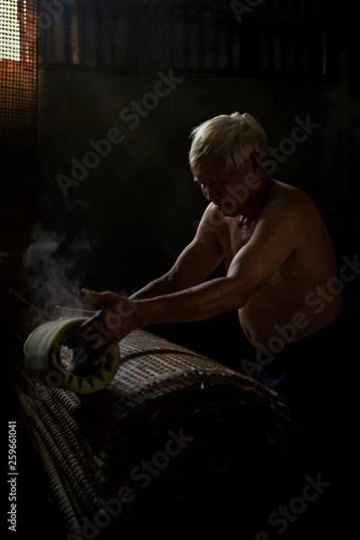 Obraz Thai men of Vietnamese descent making drying Vietnamese Rice Paper,Nongkhai,Thailand.