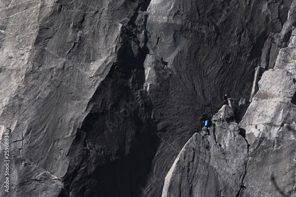 Obraz Climbers attempt to climb jagged granite of El Capitan in Yosemite National Park