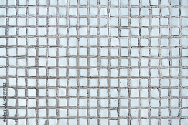 Obraz the tiles are laid unevenly. the tile has the shape of a small square