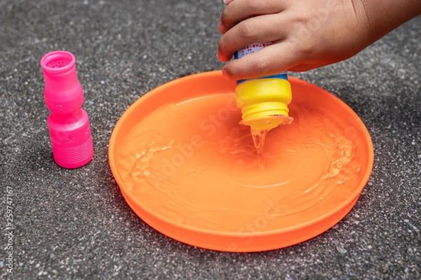 Obraz pouring soap liquid