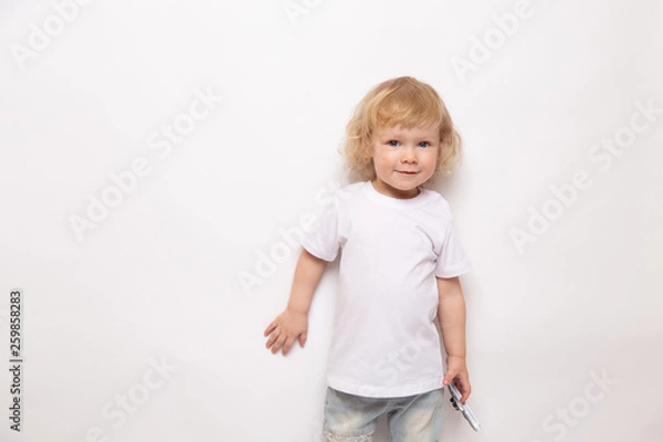 Obraz child playing with toy airplane against on a white background. concept dreams of flight
