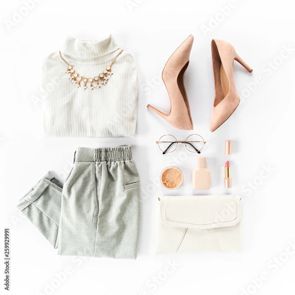 Fototapeta Woman clothes and accessories set on white background top view. modern and casual outfit. fashion, shopping and makeup concept. Flat lay, top view. 