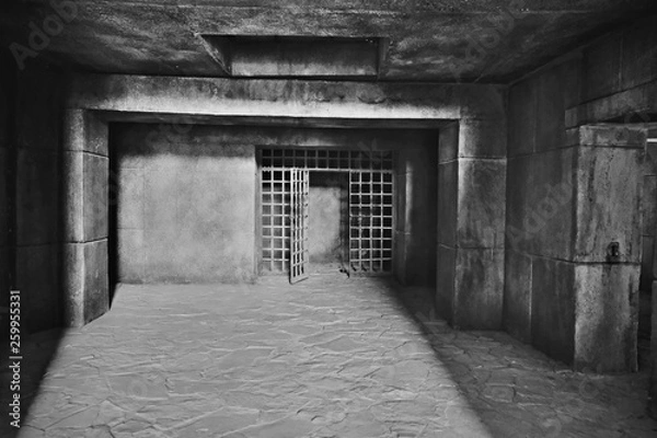 Fototapeta The entrance to the dark dungeon with walls of large concrete blocks and a ceiling of monolithic reinforced concrete, made in the form of a steel lattice