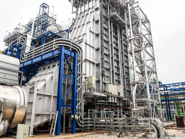 Fototapeta Heat recovery steam generator and sky in Combined-Cycle Co-Generation Power Plant which it so beautiful and popular to background power plant concept.