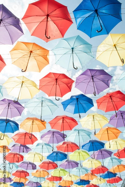 Fototapeta Multi-colored umbrellas against the sky