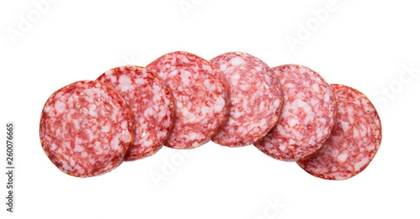 Fototapeta Top view of sliced sausage salami isolated on white background.