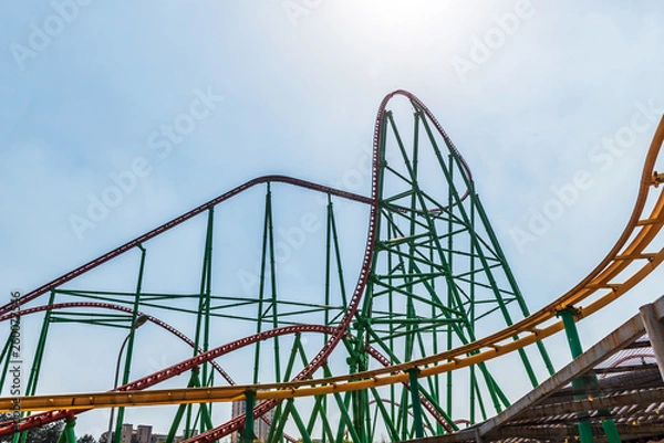 Obraz Roller Coaster loops in the sunset.