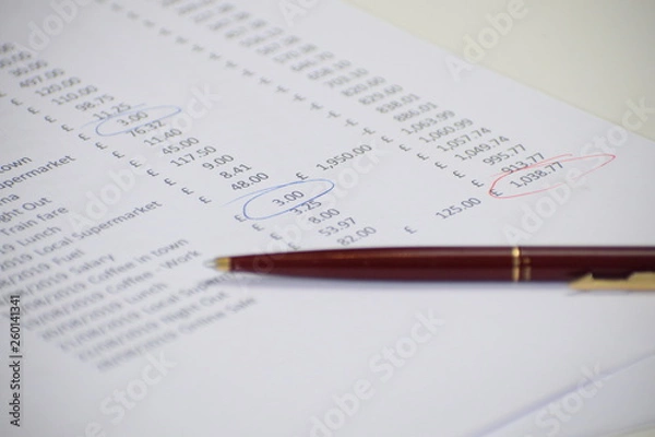 Fototapeta Balance sheet with pen