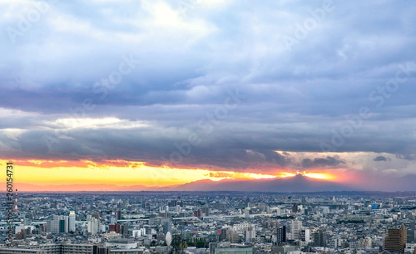 Fototapeta Nagoya cityscape in the evening with cloudy sky before heavy rain