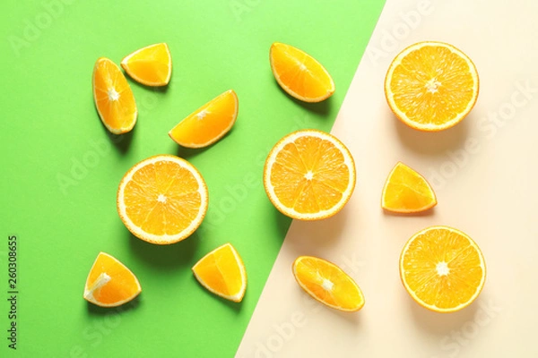 Fototapeta Flat lay composition with ripe oranges on color background