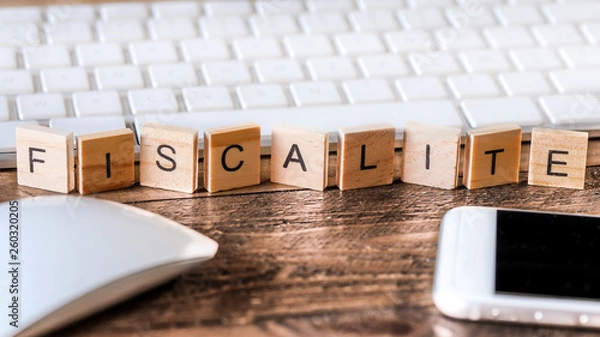 Fototapeta Litery na drewnianych elementach: podatki