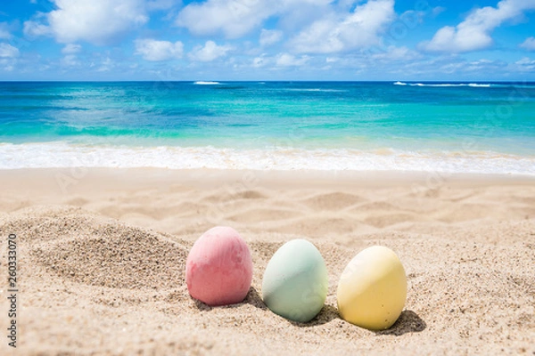 Obraz Happy easter lettering background with eggs on the sandy beach
