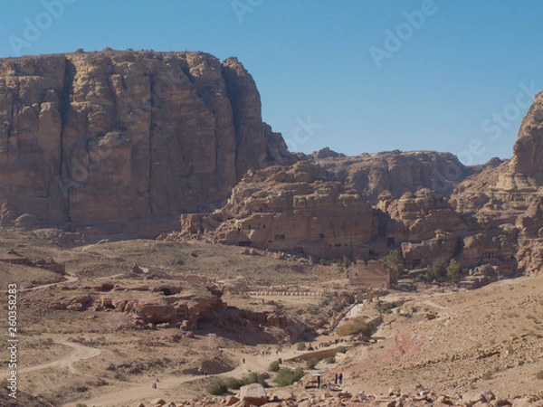 Fototapeta Petra; Raqmu - historic ruins of the ancient, rock city of the Nabatean Arabians. It is located in southwestern Jordan. It is also known as the rose-red city. UNESCO World Heritage list.