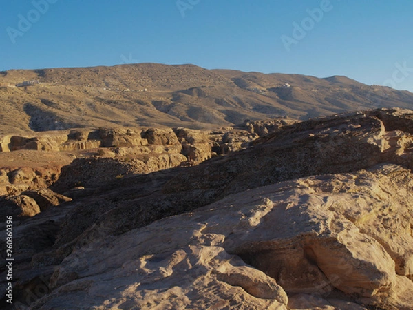 Fototapeta Petra; Raqmu - historic ruins of the ancient, rock city of the Nabatean Arabians. It is located in southwestern Jordan. It is also known as the rose-red city. UNESCO World Heritage list.
