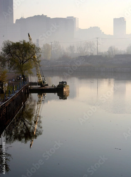 Fototapeta boat on a river with cleveland skyline