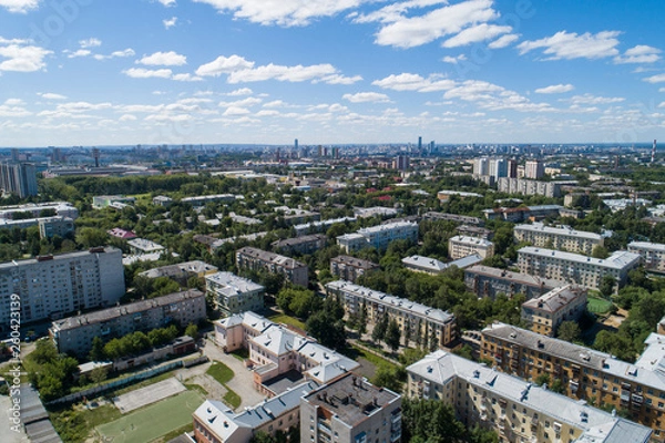 Fototapeta Top down aerial drone image of a Ekaterinburg city in the midst of summer, backyard turf grass and trees lush green.