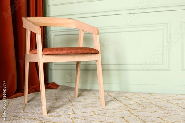 Fototapeta Modern wooden chair in interior of room