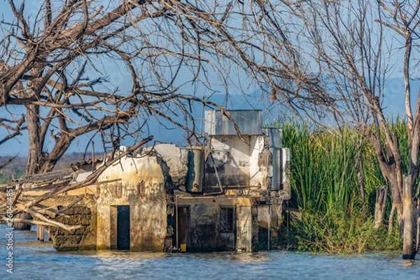 Obraz Abandoned, partially submerged buildings, on foreshore of Lake Baringo, Kenya.Water in Rift Valley lakes has risen since 2011.Possible reasons, climate change, tectonic movement, deforestation, rains.