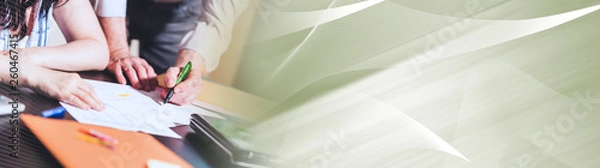 Fototapeta Coworkers working on business report, light effect. panoramic banner