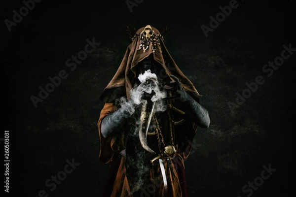 Obraz Portrait of a shaman holding a steaming horn