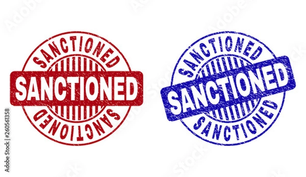 Obraz Grunge SANCTIONED round stamp seals isolated on a white background. Round seals with grunge texture in red and blue colors. Vector rubber imprint of SANCTIONED title inside circle form with stripes.