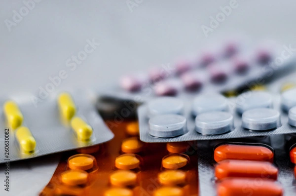 Obraz Pills for flu in the package close-up. The concept of treating colds, antidepressants, antibiotics, vitamin pills