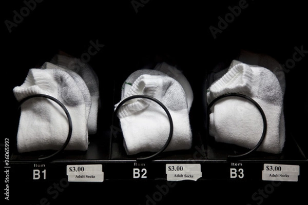 Obraz White socks for sale in vending machine at bowling alley