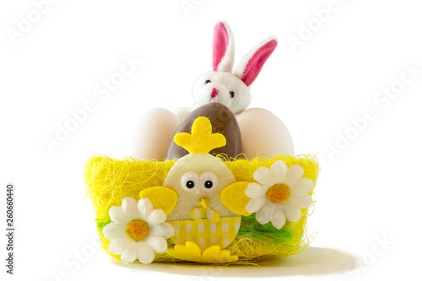Fototapeta Chocolate eggs in bird nest , Easter holiday decorations , Easter concept background. Eggs hunt.