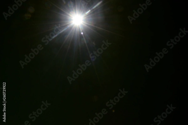 Fototapeta sun on a black background