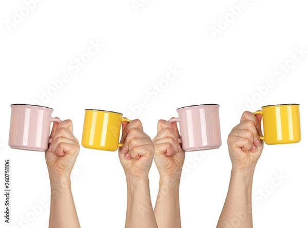 Fototapeta many raised hands up with ceramic cups on a white background