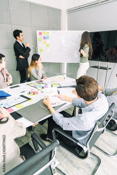 Obraz Teamwork business concept .Start up business people in modern office, working together having success. Multiethnic start-up business team on meeting in modern bright office interior brainstorming