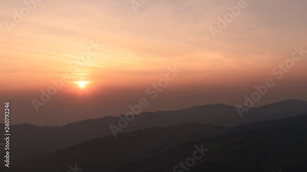 Obraz sunset time with gradiant colorful sky and mountain range