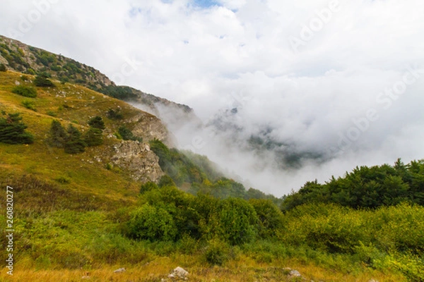 Fototapeta clouds in the mountains