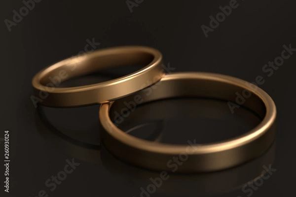 Obraz goldene eheringe aufeinander gelegt