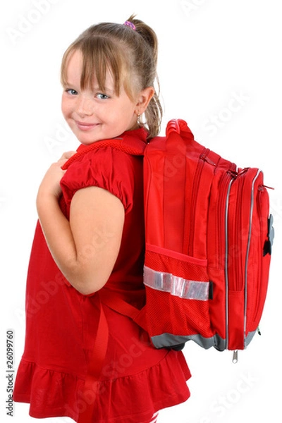 Fototapeta Small girl with red school bag smiling isolated on white
