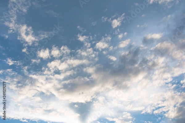Fototapeta Blue sky with clouds background with sun rays