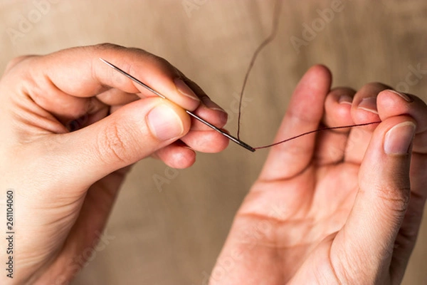 Obraz Hands with needle and thread