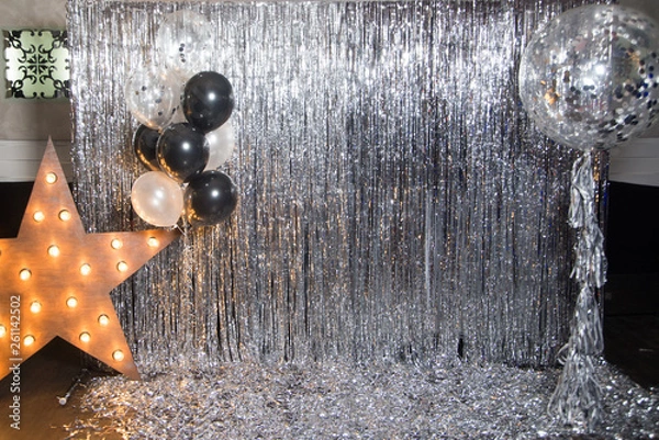 Fototapeta Foil balloons on the background against a shiny wall.