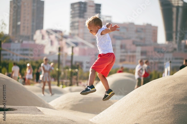 Fototapeta Boy jumping on trampoline