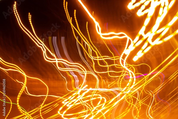 Fototapeta creative photography with unusual pattern of dancing light or neon in chaotic multi colored lines on abstract background. concept of unique desktop wallpaper or screensaver. copy space, texture, blur