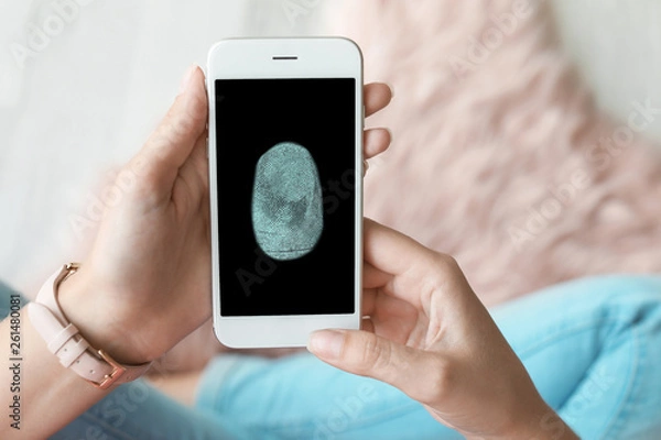 Fototapeta Woman using smartphone with blank screen, closeup. Mock up for design