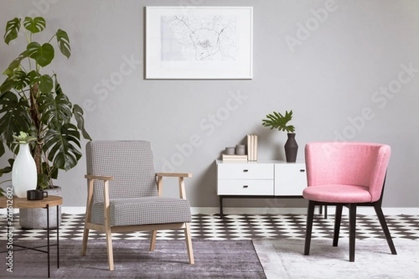 Fototapeta Pastel pink chair in beige and grey living room interior