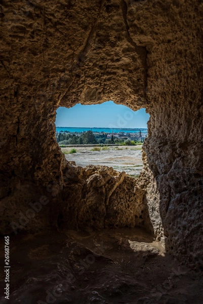 Fototapeta From Inside Cave at the Ancient Archeological Park in Syracuse, Sicily, Italy