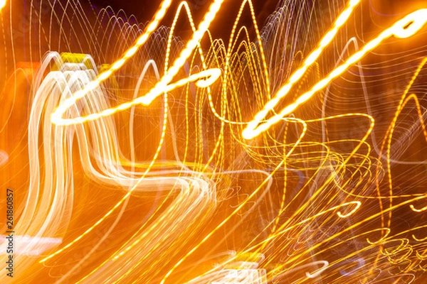 Fototapeta creative photography with unusual pattern of dancing light or neon in chaotic multi colored lines on abstract background. concept of unique desktop wallpaper or screensaver. copy space, texture, blur