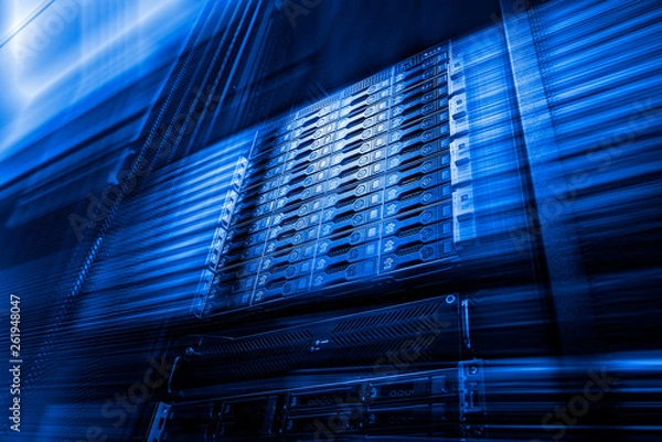 Fototapeta Point of bottom view of array disk storage in data center with depth of field in cool blue tone