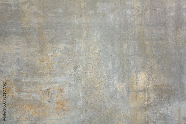 Fototapeta old dirty concrete wall with white and yellow spots of paint and scratches. rough surface texture