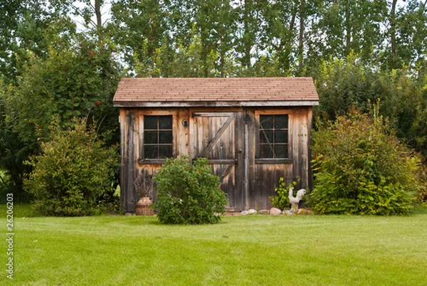 Fototapeta A charming, rustic garden shed made from reclaimed timber