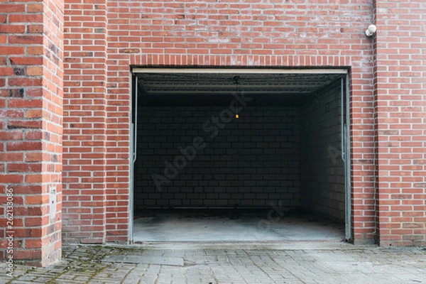 Obraz Open garage with beautiful red brick